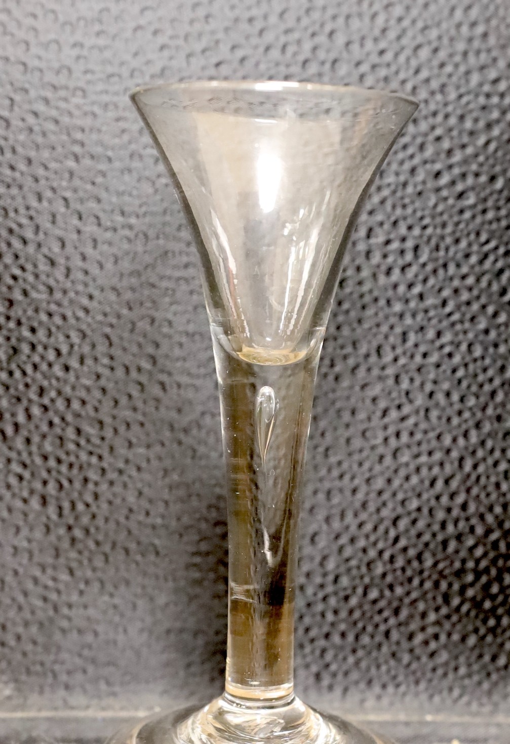 Two 18th century drawn trumpet wine glasses, one with air twist stem, tallest 15.5cm